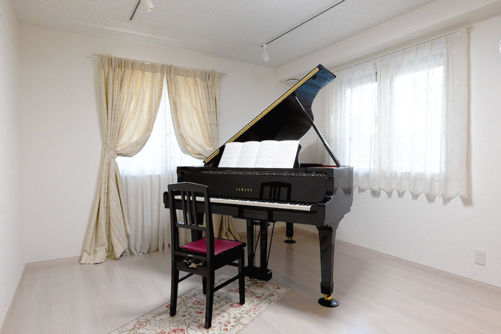 A grand piano installed in a professionally built soundproof room.